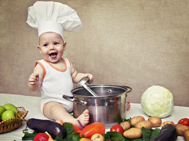 little baby in a chef's hat and ladle in hand