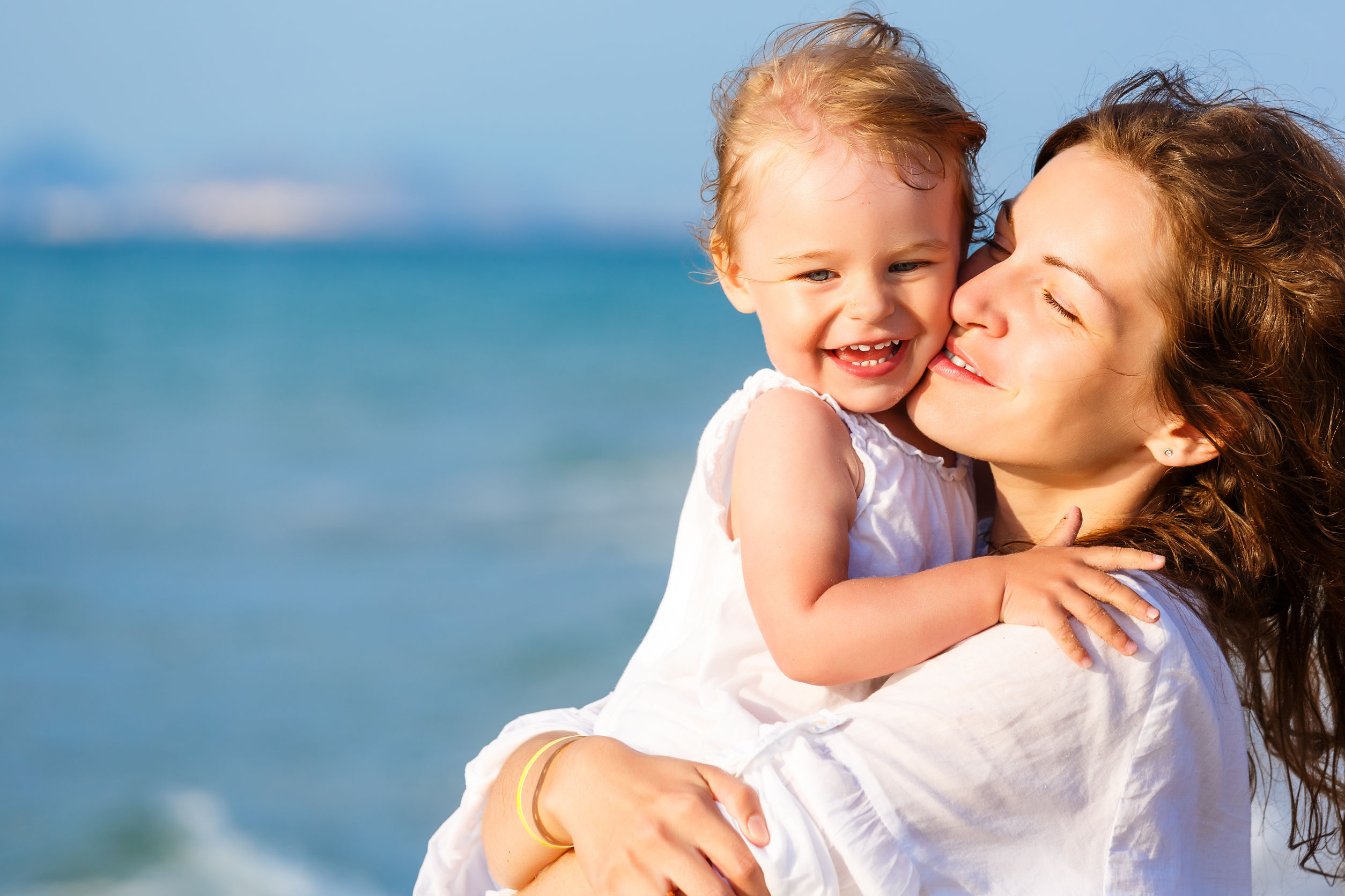 37227933 - mother and daughter on the beach