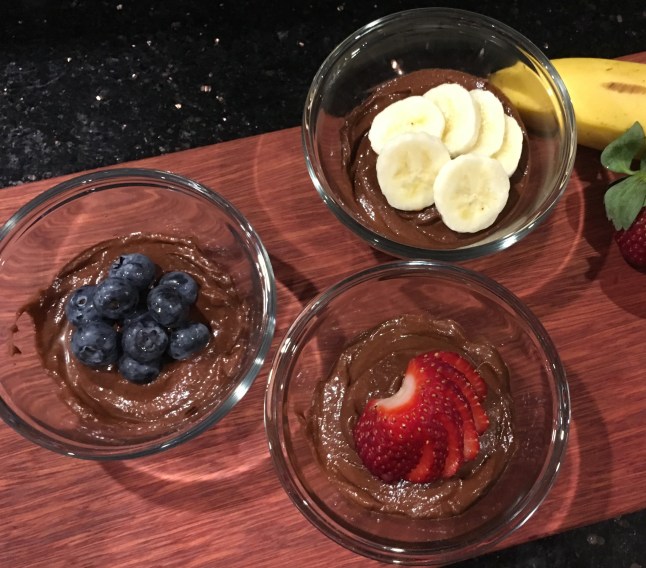 Pudding in bowls with fruit