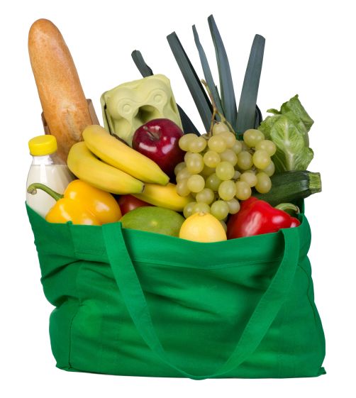 29947984 - groceries in a green bag isolated on white background